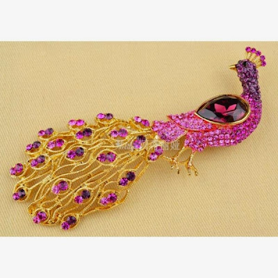 gold brooch peacock