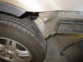 Dented panel found behind bumper during auto body repairs on Honda CR-V