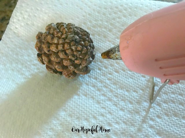 pink glue gun pine cone