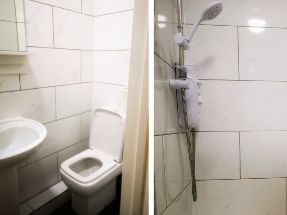 There are two images shown. The first is of a white ceramic sink and toilet in a bathroom tiled with large white tiles and grey grout lines. The second image shows the same white tiled bathroom from the other angle and shows the electric shower and cubicle available in Bede Serviced Apartments.