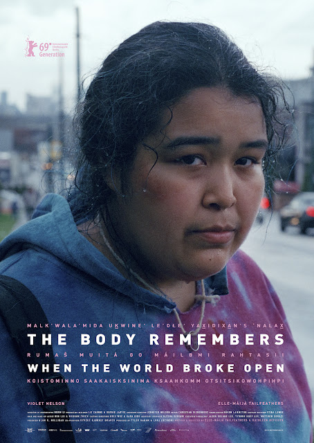 A woman wearing a blue and pink sweatshirt looking at the camera. The text reads 'The Body Remembers When The World Broke Open'.