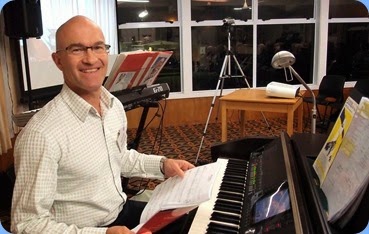 Warrren Levick preparing to play the Clavinova for us in the first half of the programme. Photo courtesy of the Club's photographer, Dennis Lyons.
