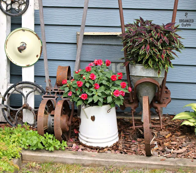 Photo of a beautiful junk garden vignette.