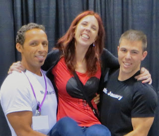 Melanie.ps, thepurplescarf, Posing with Toronto Firemen Calendar Mr. January and Mr. March at The National Women's Show in Toronto