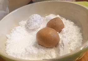 these are three crinkle cookies made with cinnamon flavors and buttery cookies rolled in powdered sugar with crinkles on top