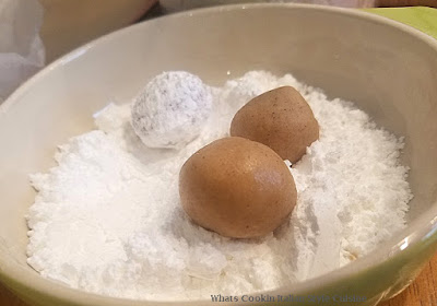 these are three crinkle cookies made with cinnamon flavors and buttery cookies rolled in powdered sugar with crinkles on top