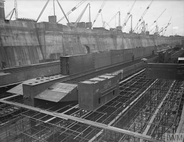 Steel 'Bombardons' being built in a dry dock.