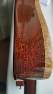 showcasing the beautiful mahogany wood and thick maple cap on this guitar