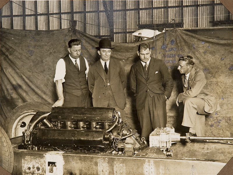 Group inspecting the car "F.H. Stewart Enterprise"