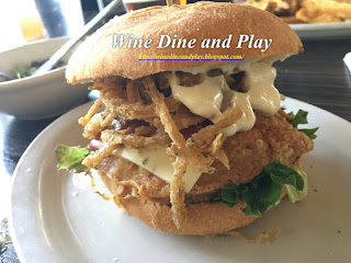The Spicy BBQ chicken sandwich is deep fried, topped with jack cheese, chipotle BBQ and garlic aioli at The Three Birds Tavern in St. Petersburg, Florida.
