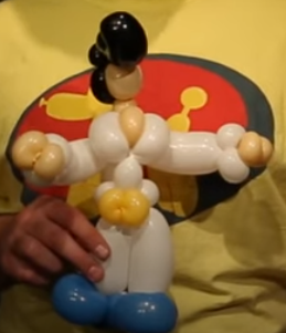 Modellage einer Figur aus Luftballons von Elvis Presley.