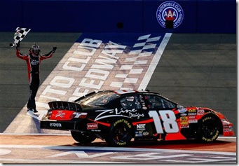 2010 Auto Club Feb NNS Kyle Busch with checkered flag