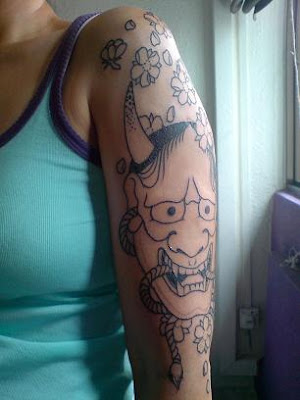 This is my tattoo. It's an age-old Japanese tattoo image, of a hanya mask, 