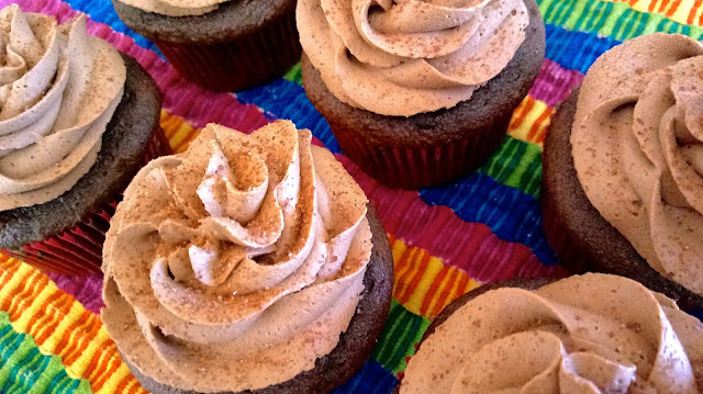 finished Mexican Hot Chocolate Cupcakes sitting on a colorful latin style place mat