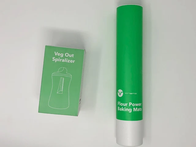 The green boxes for the handheld Vremi Spiralizer and silicone baking mats