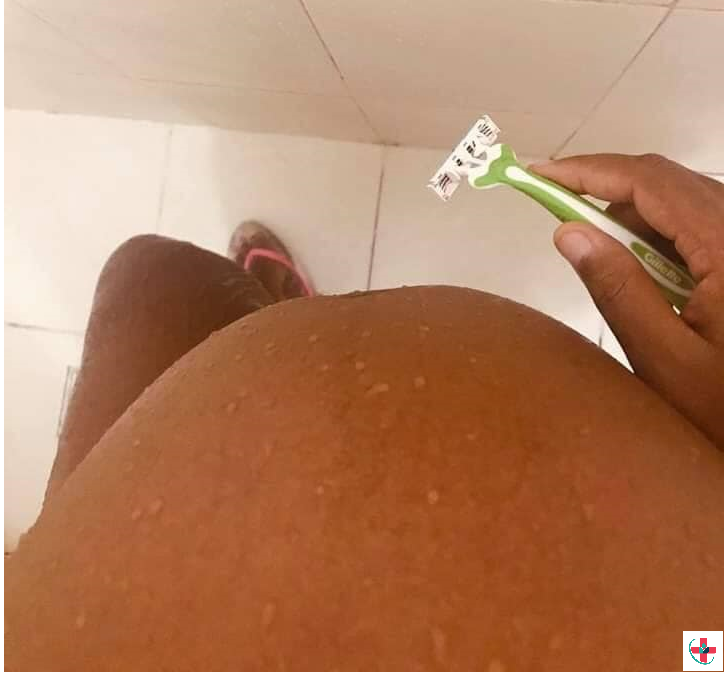 Pregnant woman shaving her pubic hair