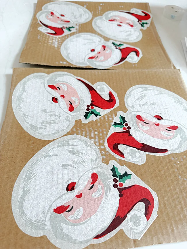 Santa napkins decoupaged to cardboard