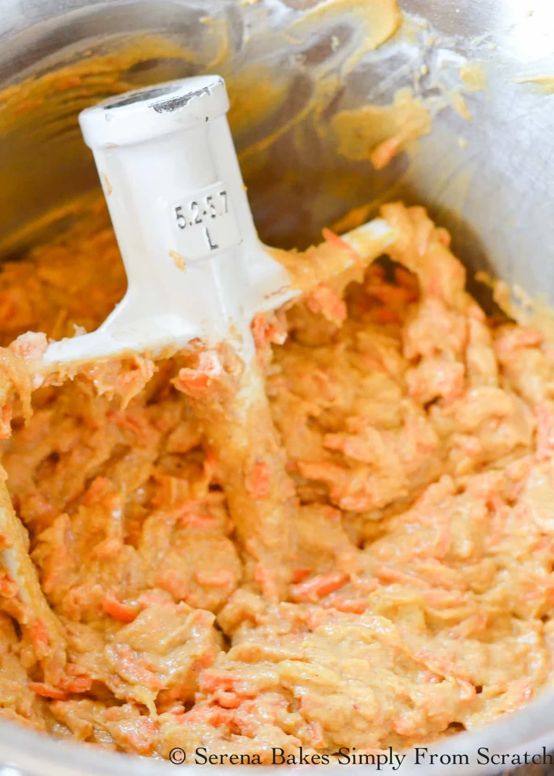 Carrot Cake with Pineapple batter in a stainless steel mixing bowl.