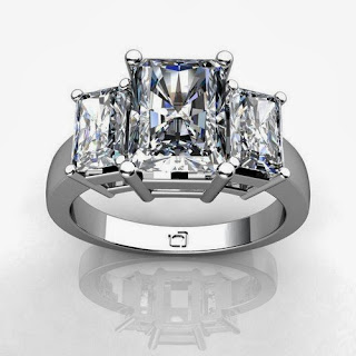 Palladium This Past Present and Future Ring for Radiant Cut Diamonds uses basket style settings to showcase the diamond's brilliance.