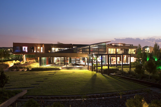 Modern house lit up at night