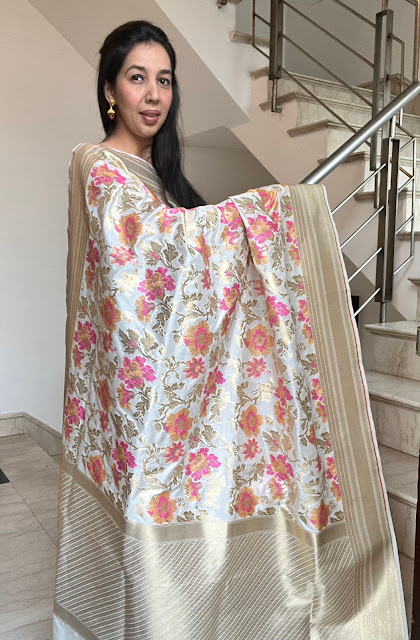 Pearl White silk saree with a pop of colourful floral jaal