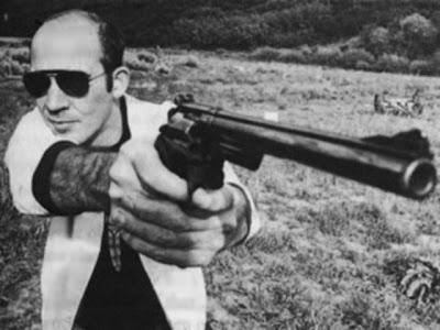 Hunter S. Thompson holding what appears to be a .44 Magnum