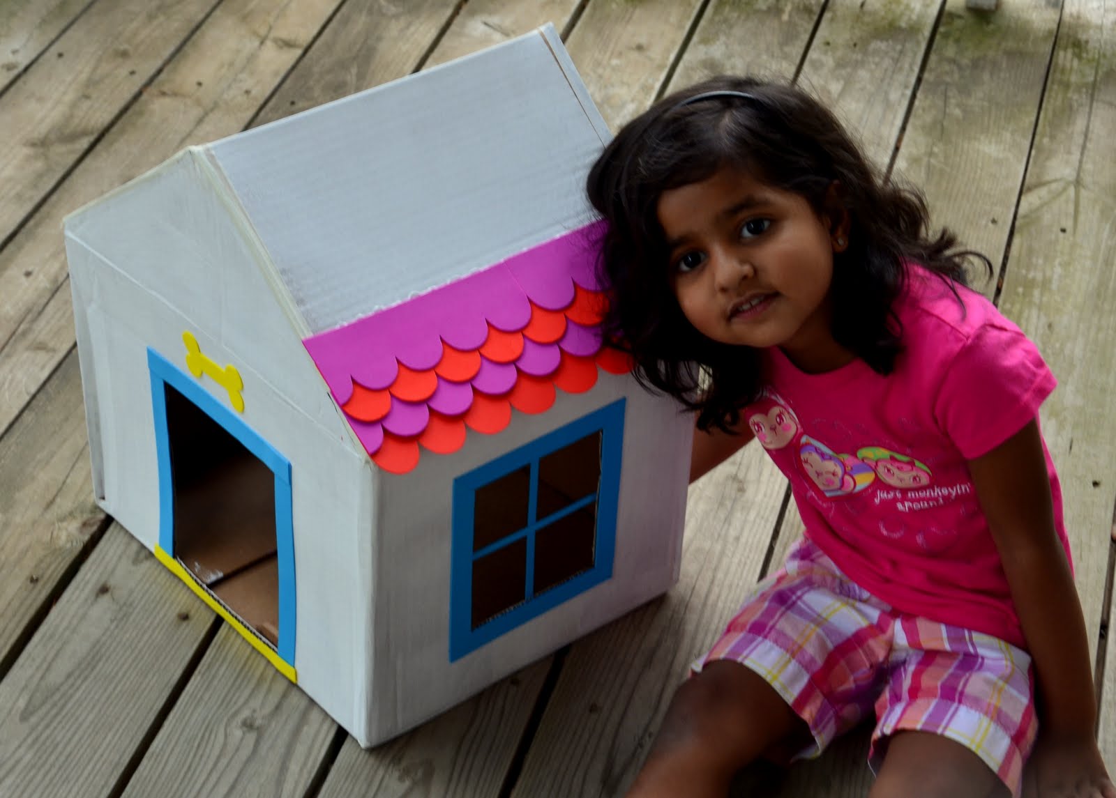 Saanvi enjoying making a dog house