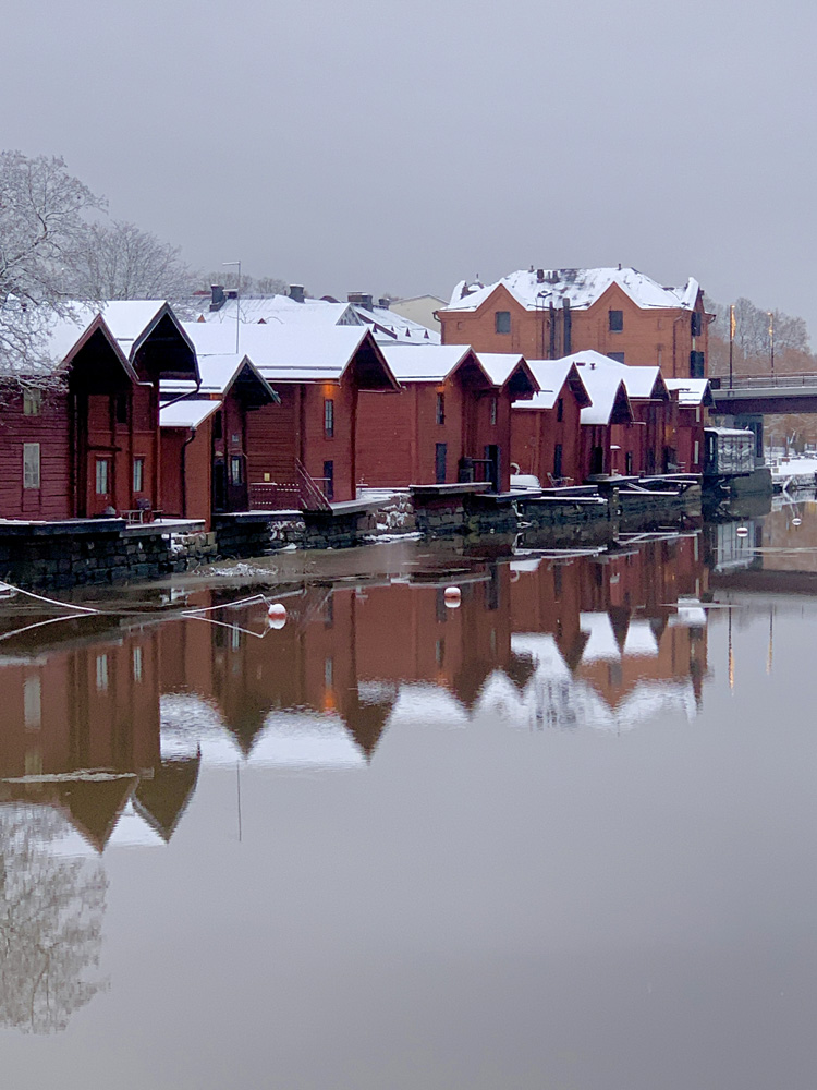Old red, wooden warehouses by the river