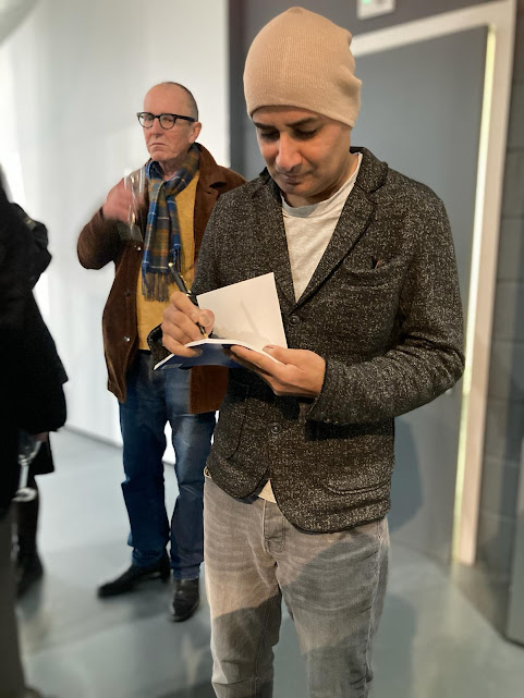 Taz Rahman signing copies of his poetry collection 'East of the Sun, West of the Moon', at g39, Cardiff on 14th March 2024