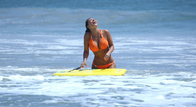 KIM KARDASHIAN laughing in the ocean