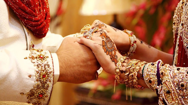 An arranged marriage in which the brides have peked each other's hands