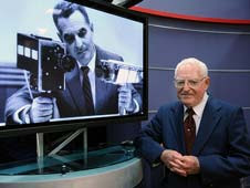 Stan Lebar next to an image of him with the lunar camera