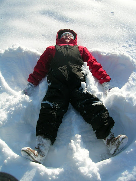 Quinn making a snow angel