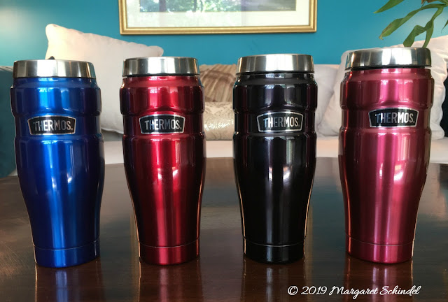 Four Thermos Stainless King Travel Tumblers in different colors