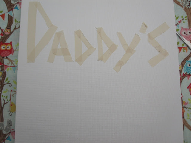 Canvas with lettering in masking tape