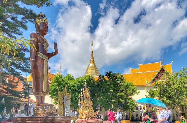 There is huge space around the main temple. Above photograph shows the circular space around the main temple of Doi Suthep and this section has various statues of Budhhas of various sizes, flower gardens, seating areas and enough to walk around & explore surrounding landscapes. 