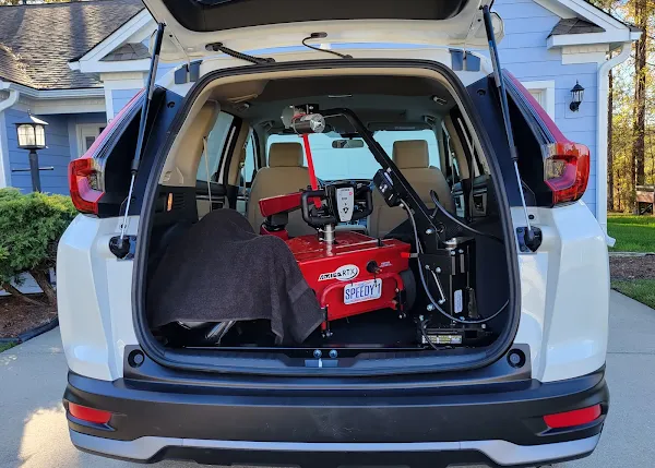 Scooter loaded in the back of the car