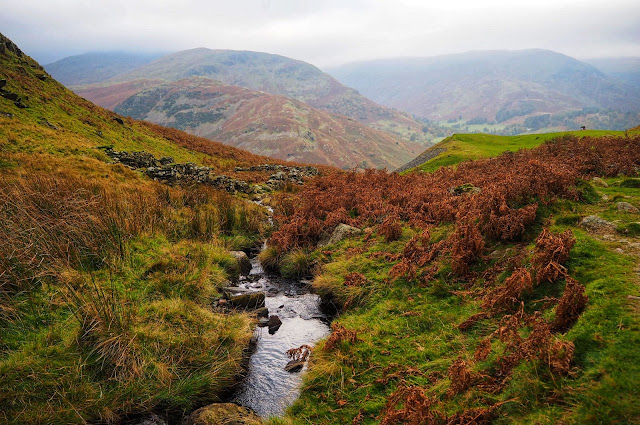 Beautiful autumnal colours with mini stream viewed from atop Ullswater Lake District