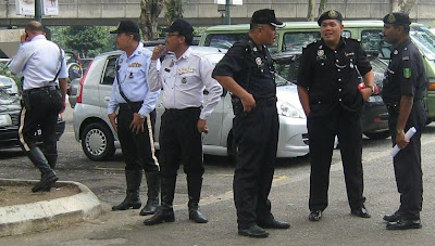 Traffic police milling around Pasar Seni together with regular police