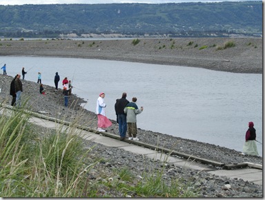 The Fishing Hole, Homer, AK. Two ladies from the nearby Russian village, wearing traditional clothing, are a part of the fishing group.