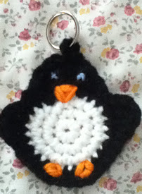 http://www.ravelry.com/patterns/library/crochet-penguin-keychain