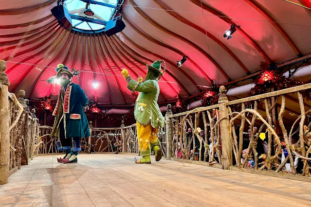 Elves on a stage at Lapland UK check in