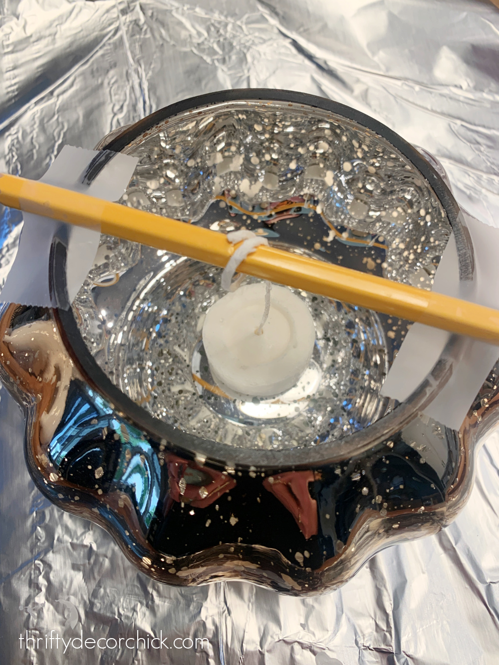 securing wick in candle