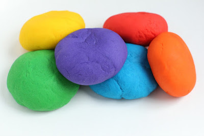 Learn how to make playdough with this simple recipe. You will need flour, salt, cream of tartar, vegetable oil, water and Kool Aid packets.
