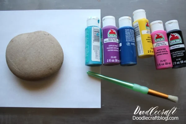 Painting a galaxy with stars and planets and the moon on a rock with hand lettered text diy instructions