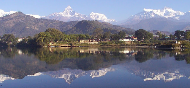 A lake beneath hills and mountains - Images provided by http://photoforu.blogspot.com/