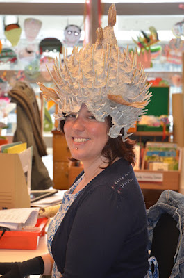 Rachael works at her desk wearing a Porcupine Fish Helmet