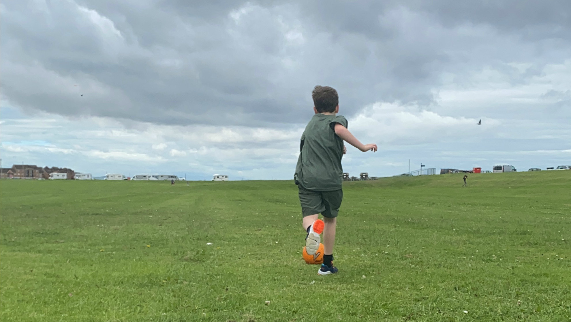 Boy running with a football
