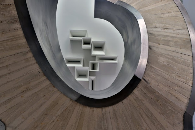 Concrete spiral stairs in The Memory House by A-Cero Architects