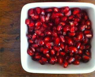 One half of pomegranate de-seeded